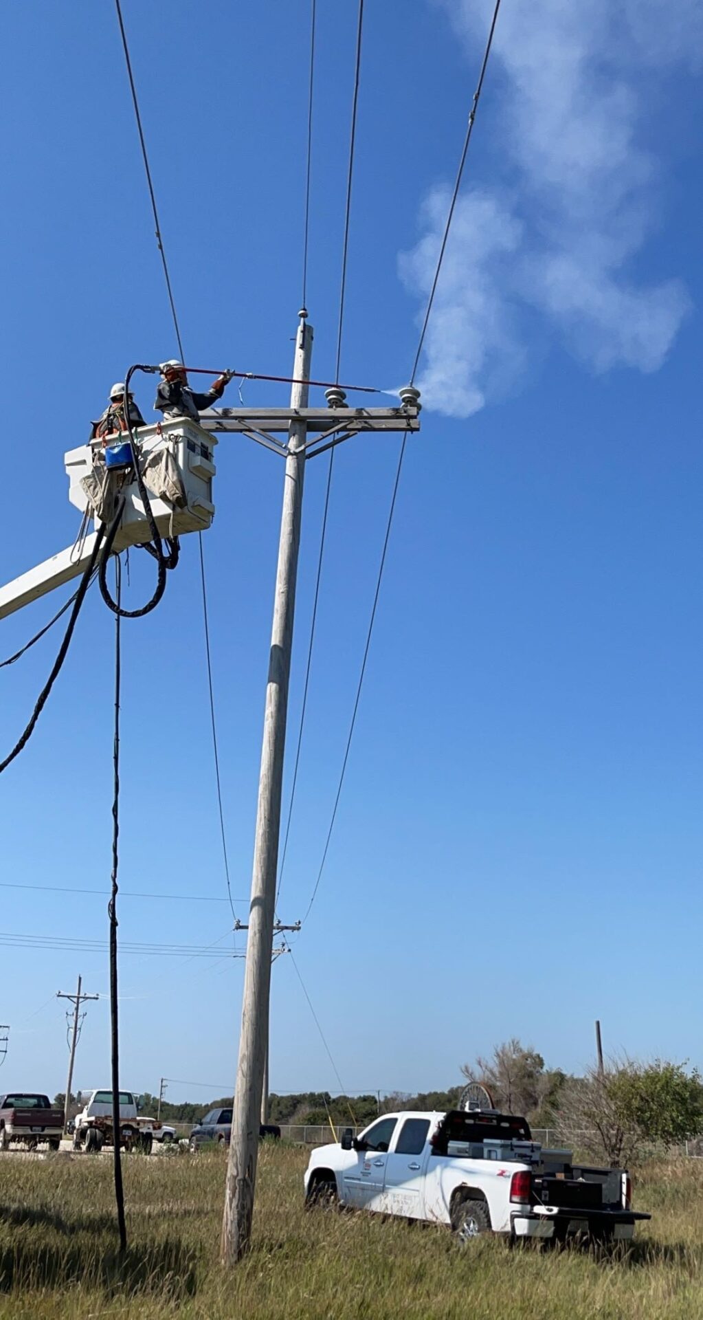 An Electric Pole Below Blue Color Sky